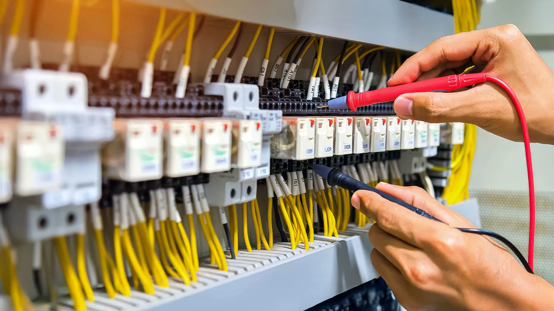 Brisbane homeowner phoning an emergency electrician after hours
