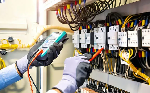Thermal imaging camera checking a switchboard for overheating terminals