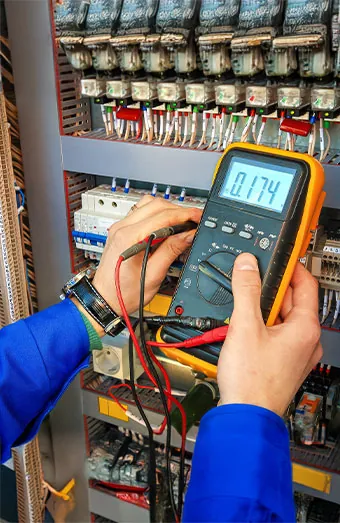 Electrician measuring RCD trip time during a Brisbane electrical safety inspection