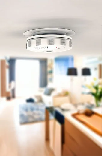 Photoelectric smoke alarm with a sealed 10 year lithium battery mounted on a ceiling