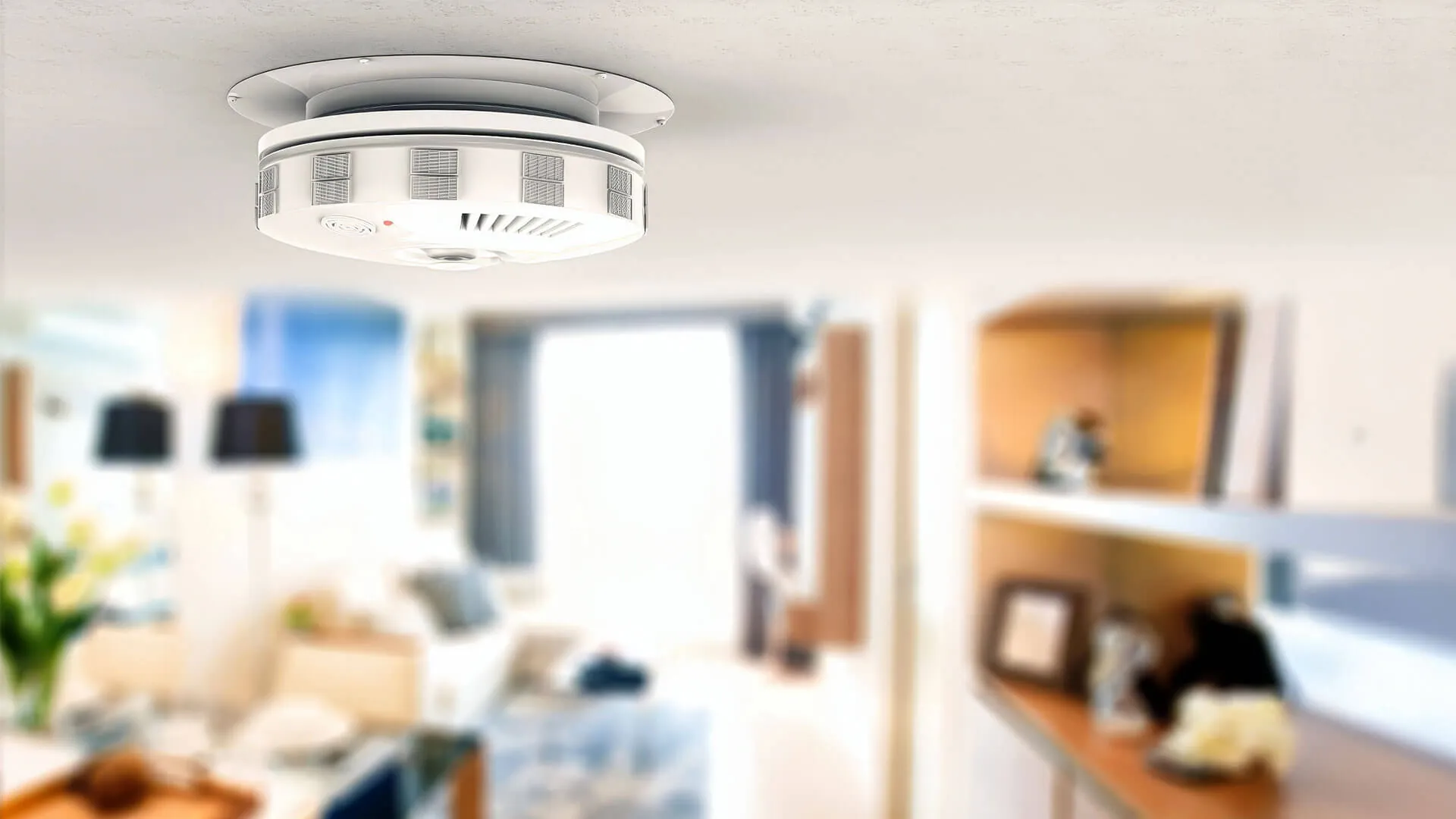 Licensed electrician installing an interconnected photoelectric smoke alarm